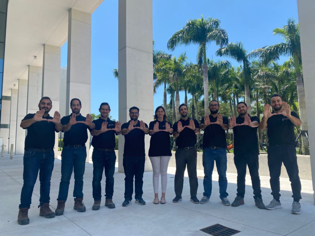 Structures and Materials Lab team standing outside engineering building